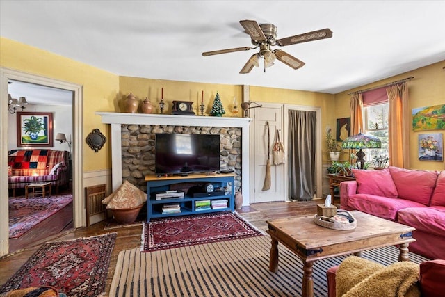 living room featuring hardwood / wood-style flooring and ceiling fan