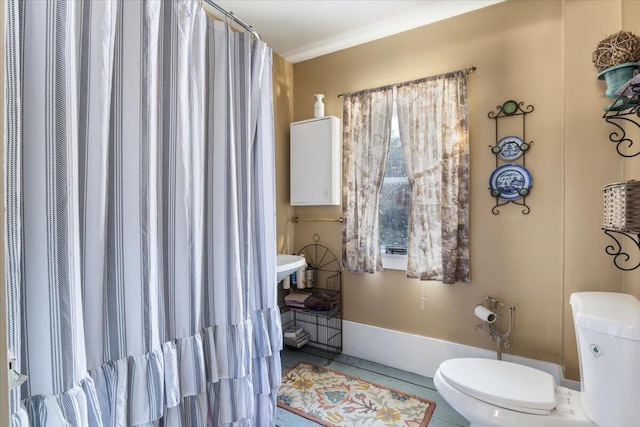 bathroom featuring tile patterned floors and toilet