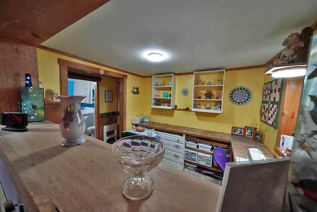 dining room featuring crown molding