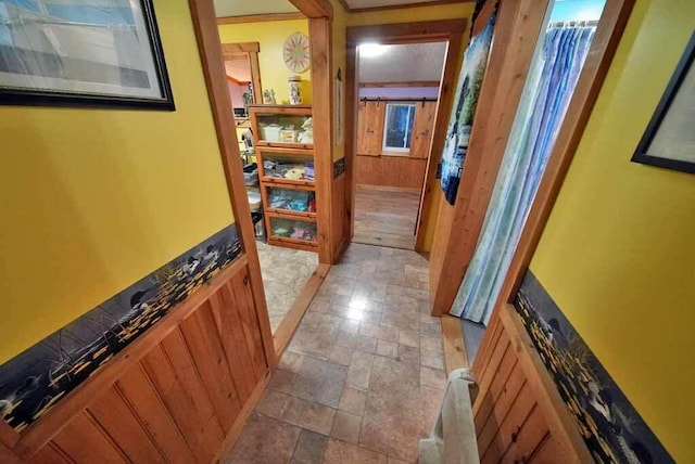 hallway featuring stone finish floor