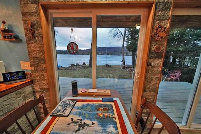 doorway to outside featuring a water view