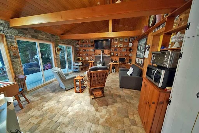 living area featuring wood ceiling, vaulted ceiling with beams, and stone finish flooring