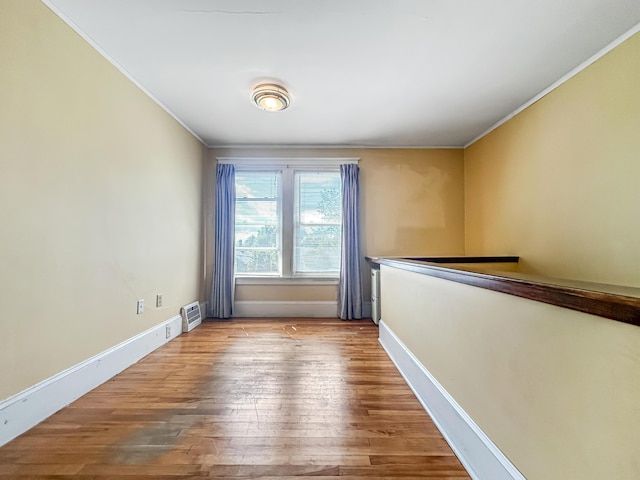 spare room with hardwood / wood-style floors