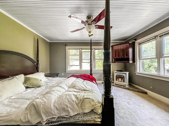 carpeted bedroom with ceiling fan, a wood stove, and crown molding