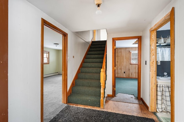 192 Fox Hill Rd, Athens, ME 04912 - stairs featuring a baseboard radiator, carpet flooring, and baseboards