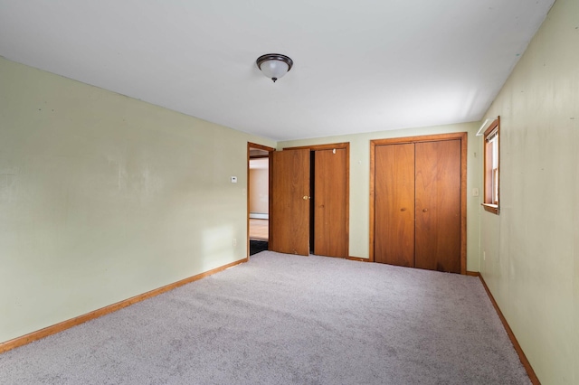 192 Fox Hill Rd, Athens, ME 04912 - unfurnished bedroom featuring multiple closets, carpet floors, and baseboards