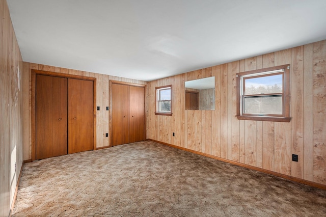 192 Fox Hill Rd, Athens, ME 04912 - unfurnished bedroom featuring two closets, multiple windows, carpet flooring, and baseboards