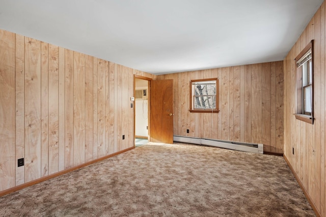 192 Fox Hill Rd, Athens, ME 04912 - empty room featuring a baseboard radiator, wood walls, carpet floors, and baseboards