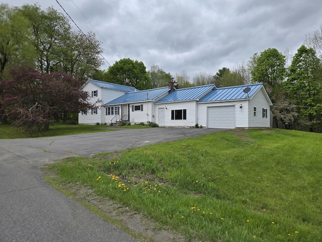 192 Fox Hill Rd, Athens, ME 04912 - view of front facade with driveway, a chimney, a garage, a standing seam roof, and metal roof