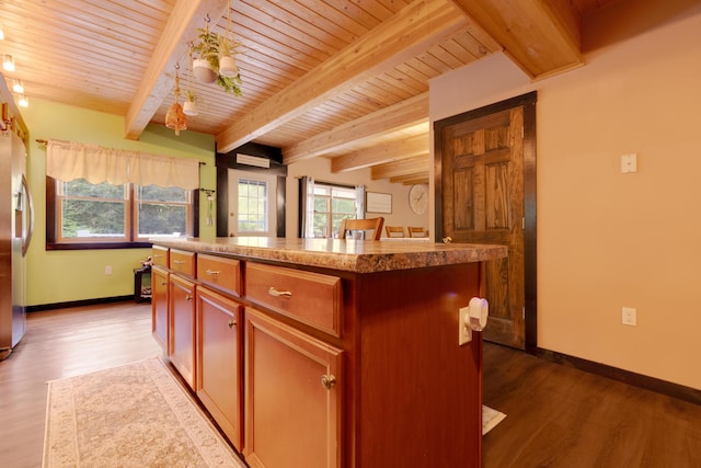 kitchen with beam ceiling, a center island, stainless steel refrigerator with ice dispenser, wood-type flooring, and wooden ceiling