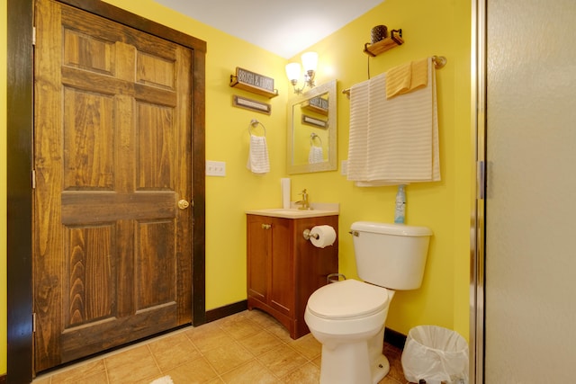 bathroom with vanity, toilet, and a shower with shower door