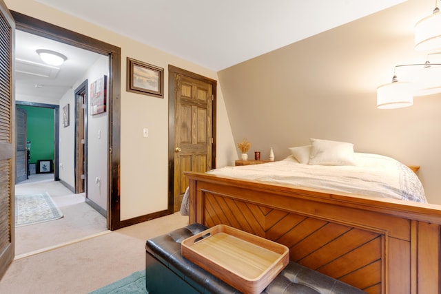 bedroom featuring a closet and light carpet