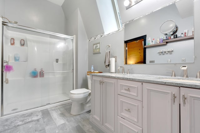 bathroom with a shower with door, vanity, hardwood / wood-style floors, and toilet