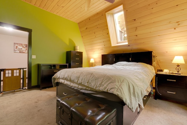 bedroom with wood ceiling, lofted ceiling, light carpet, and wood walls