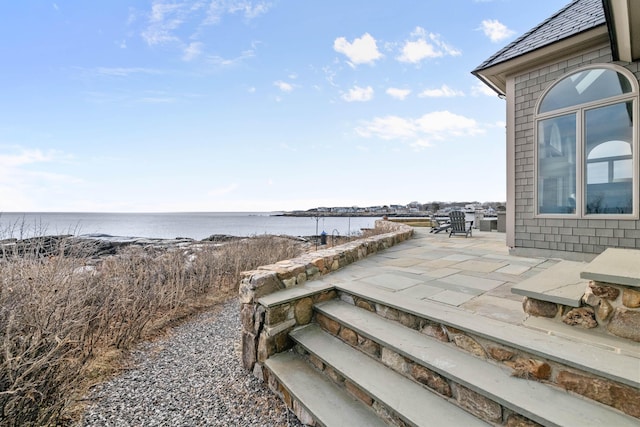 view of patio / terrace with a water view