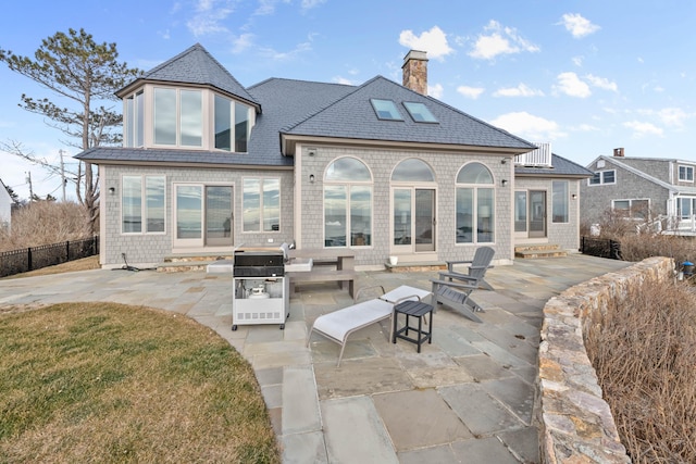 rear view of house featuring a patio