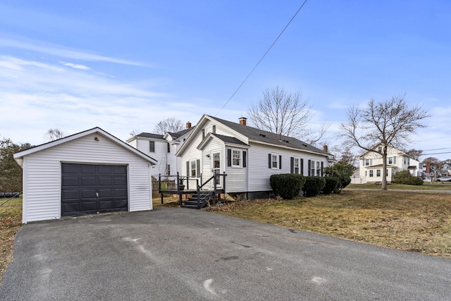 view of front of home featuring an outbuilding and a garage