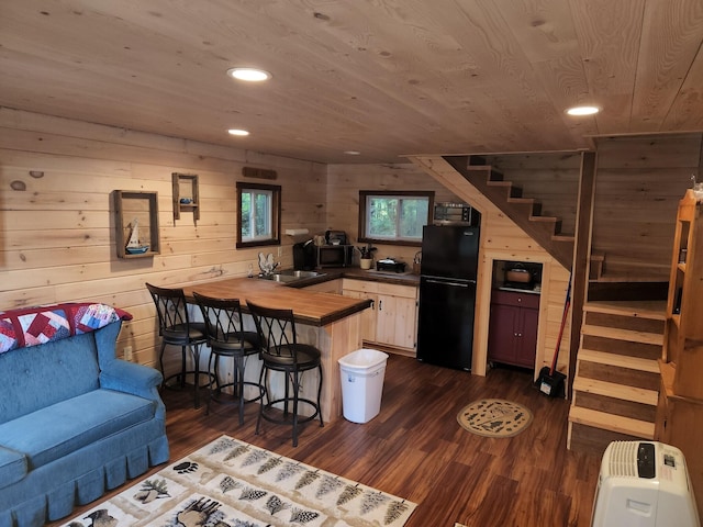 380 Cedar Lake Rd Unit T3 R9, Nwp, ME 04462 - kitchen featuring black appliances, a peninsula, a sink, wooden ceiling, and recessed lighting