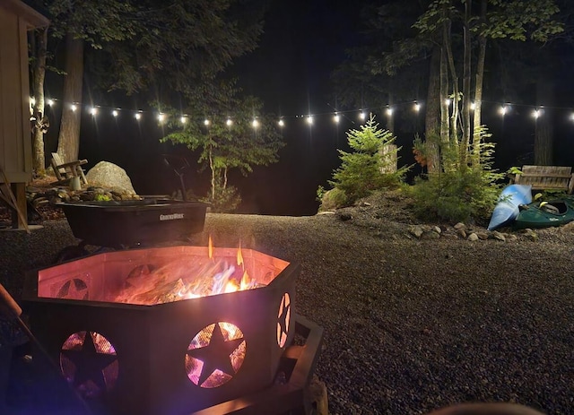 380 Cedar Lake Rd Unit T3 R9, Nwp, ME 04462 - yard at twilight with an outdoor fire pit