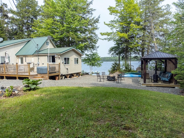 380 Cedar Lake Rd Unit T3 R9, Nwp, ME 04462 - view of grassy yard with a gazebo, a deck with water view, and a fire pit