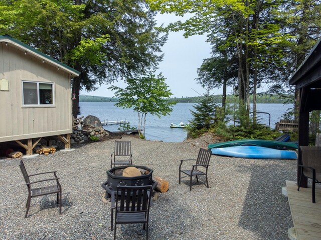 380 Cedar Lake Rd Unit T3 R9, Nwp, ME 04462 - view of patio featuring an outdoor fire pit and a water view