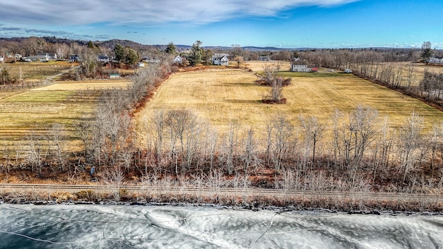 birds eye view of property with a rural view