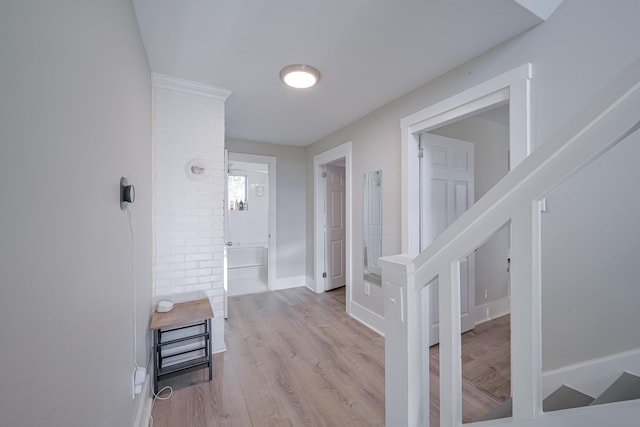 hall with light hardwood / wood-style floors