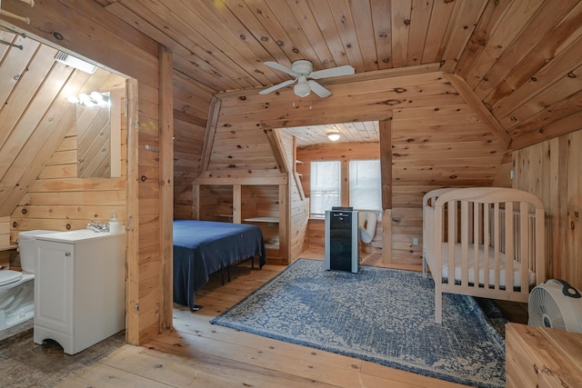 bedroom with wooden walls, ceiling fan, wooden ceiling, and light wood-type flooring