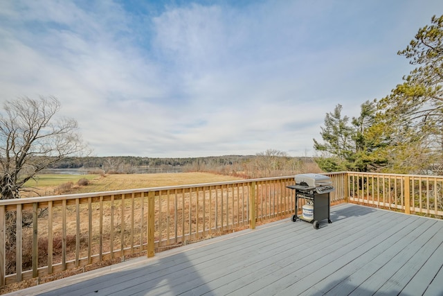 wooden terrace with a grill