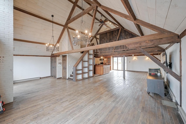 unfurnished living room featuring ceiling fan with notable chandelier, a baseboard heating unit, beam ceiling, high vaulted ceiling, and hardwood / wood-style floors