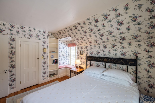 bedroom with hardwood / wood-style flooring