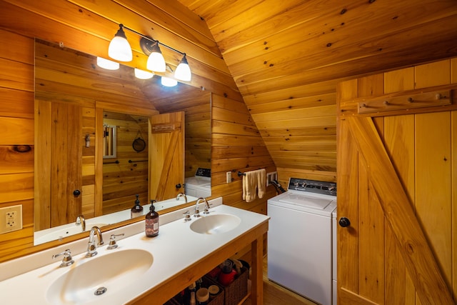 bathroom featuring wood walls, vaulted ceiling, washer / dryer, vanity, and wood ceiling