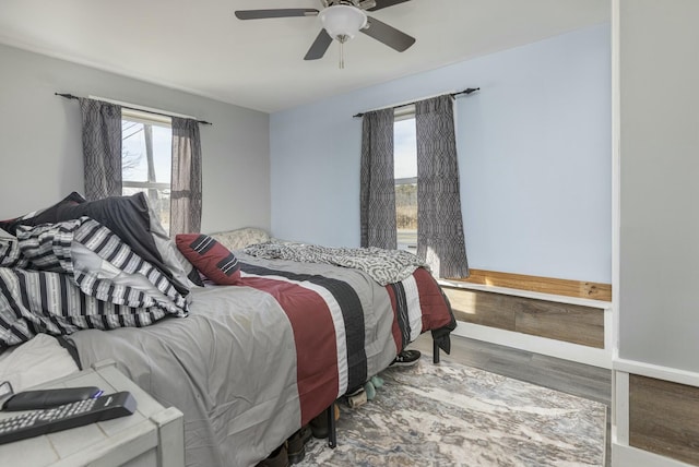 bedroom featuring hardwood / wood-style floors and ceiling fan