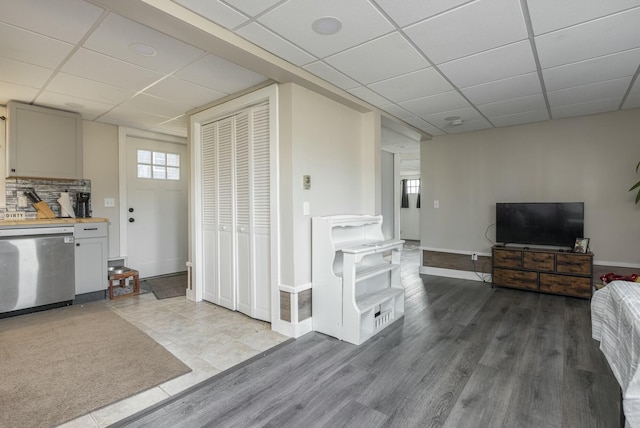 interior space featuring hardwood / wood-style floors and a paneled ceiling