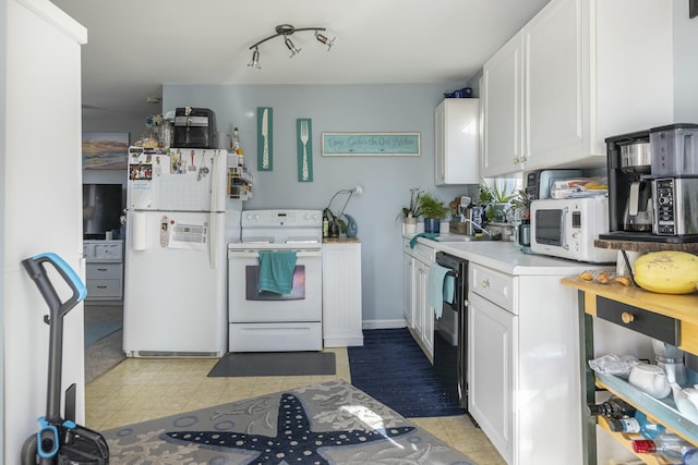 kitchen with white cabinets, white appliances, and sink