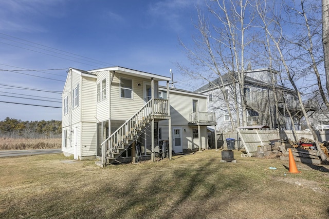 rear view of house with a yard