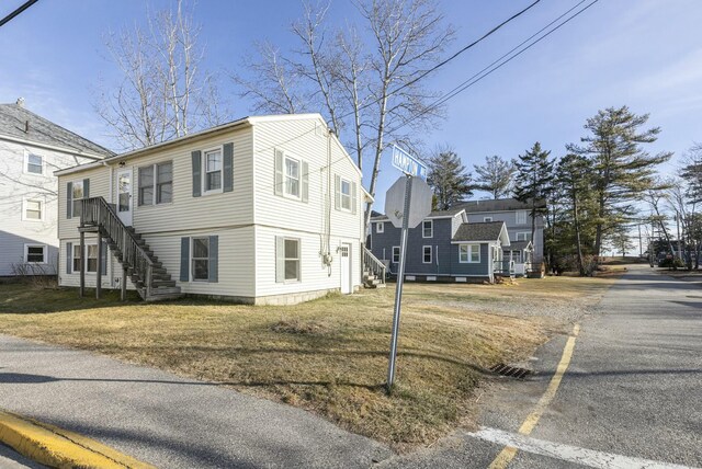 view of property exterior featuring a yard