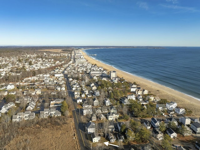 aerial view with a water view and a beach view