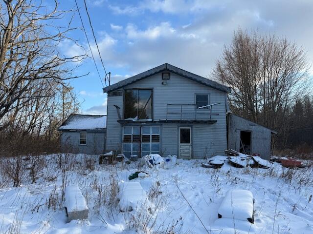 view of snow covered property