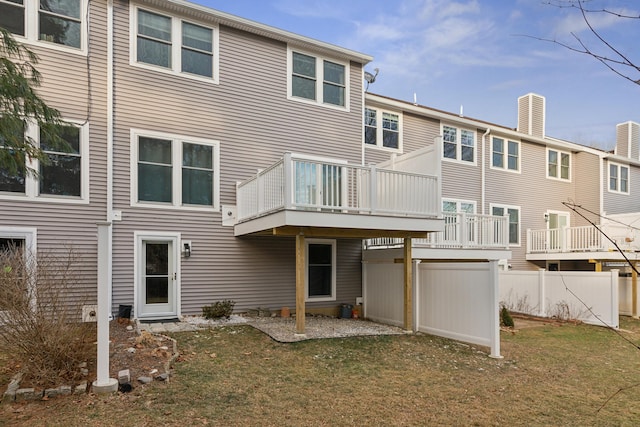 29 Sadler Dr Unit 29, Brunswick, ME 04011 - back of house featuring a deck and a lawn
