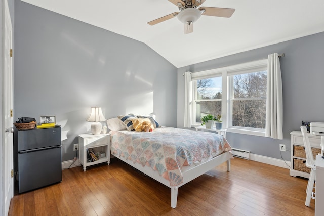 29 Sadler Dr Unit 29, Brunswick, ME 04011 - bedroom featuring wood-type flooring, fridge, vaulted ceiling, and ceiling fan