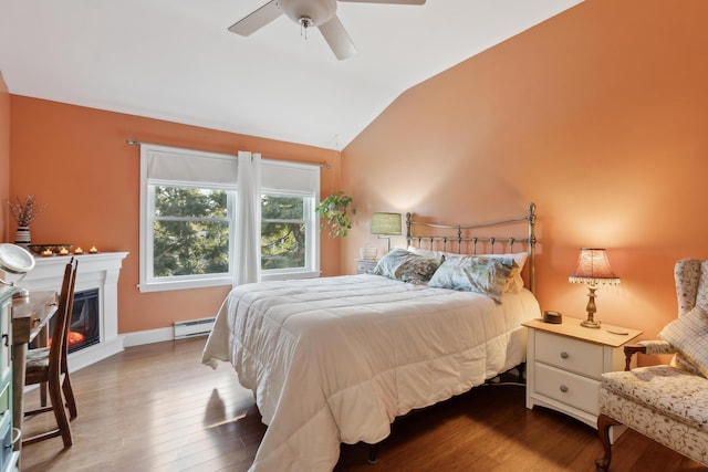 29 Sadler Dr Unit 29, Brunswick, ME 04011 - bedroom featuring hardwood / wood-style flooring, ceiling fan, lofted ceiling, and a baseboard radiator