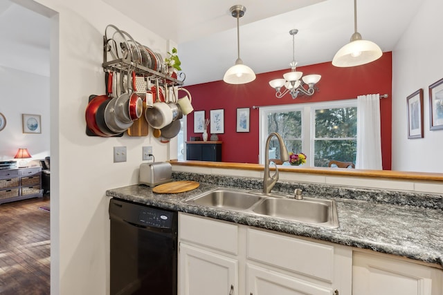 29 Sadler Dr Unit 29, Brunswick, ME 04011 - kitchen with white cabinetry, dishwasher, sink, hanging light fixtures, and a chandelier