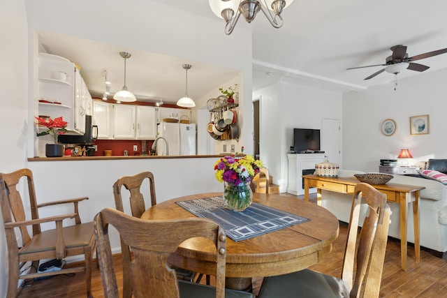 29 Sadler Dr Unit 29, Brunswick, ME 04011 - dining room featuring wood-type flooring and ceiling fan with notable chandelier