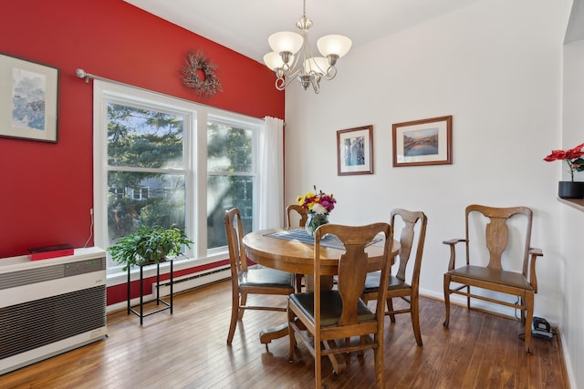 29 Sadler Dr Unit 29, Brunswick, ME 04011 - dining space with hardwood / wood-style floors, heating unit, plenty of natural light, and a chandelier