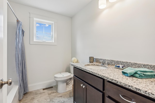 full bathroom featuring shower / tub combo, vanity, and toilet