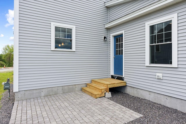 doorway to property with a patio