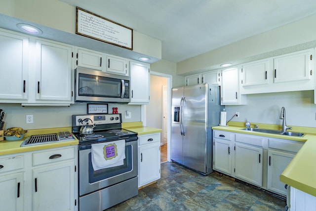 kitchen featuring white cabinets, sink, and stainless steel appliances