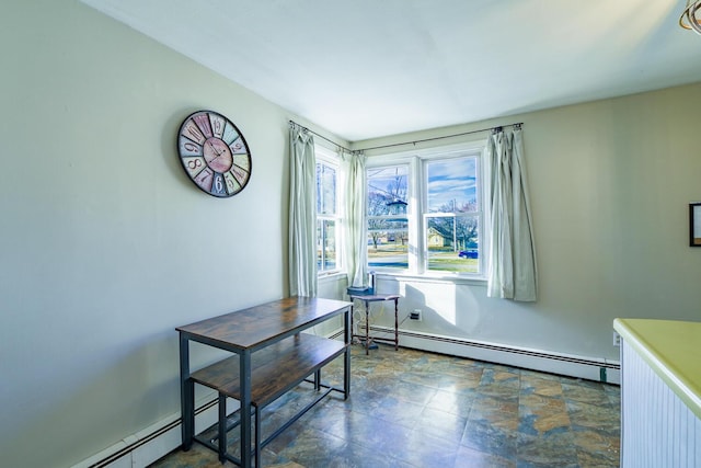 dining room with a baseboard heating unit