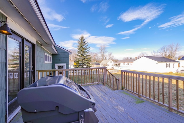 wooden terrace with area for grilling